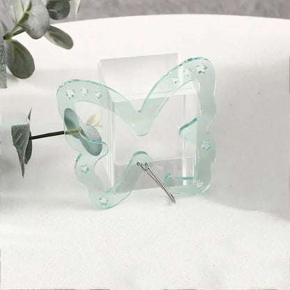 Translucent light green resin music note butterfly hair clip with star cutouts and metallic pin for bags creative bag use