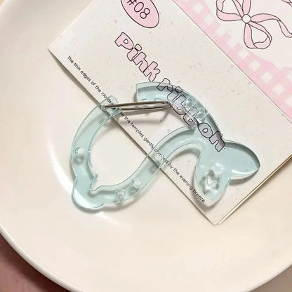 Translucent light blue acrylic bow hair clip with star cutouts shown alongside resin music note bags creative bag pendant