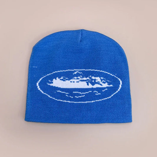 A vibrant royal blue knit beanie hat autumn featuring white embroidered island design for men women street skateboarding printing beanies