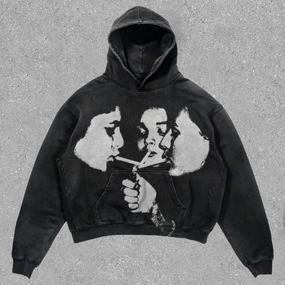 Black hoodie with distressed grayscale graphic of two faces sharing a cigarette in hip hop y2k american style sweatshirts