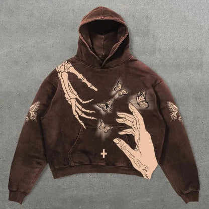 Brown hoodie with cream ink graphic of skeletal and flesh toned hands and butterflies in hip hop y2k style american style sweatshirts and korean harajuku fashion