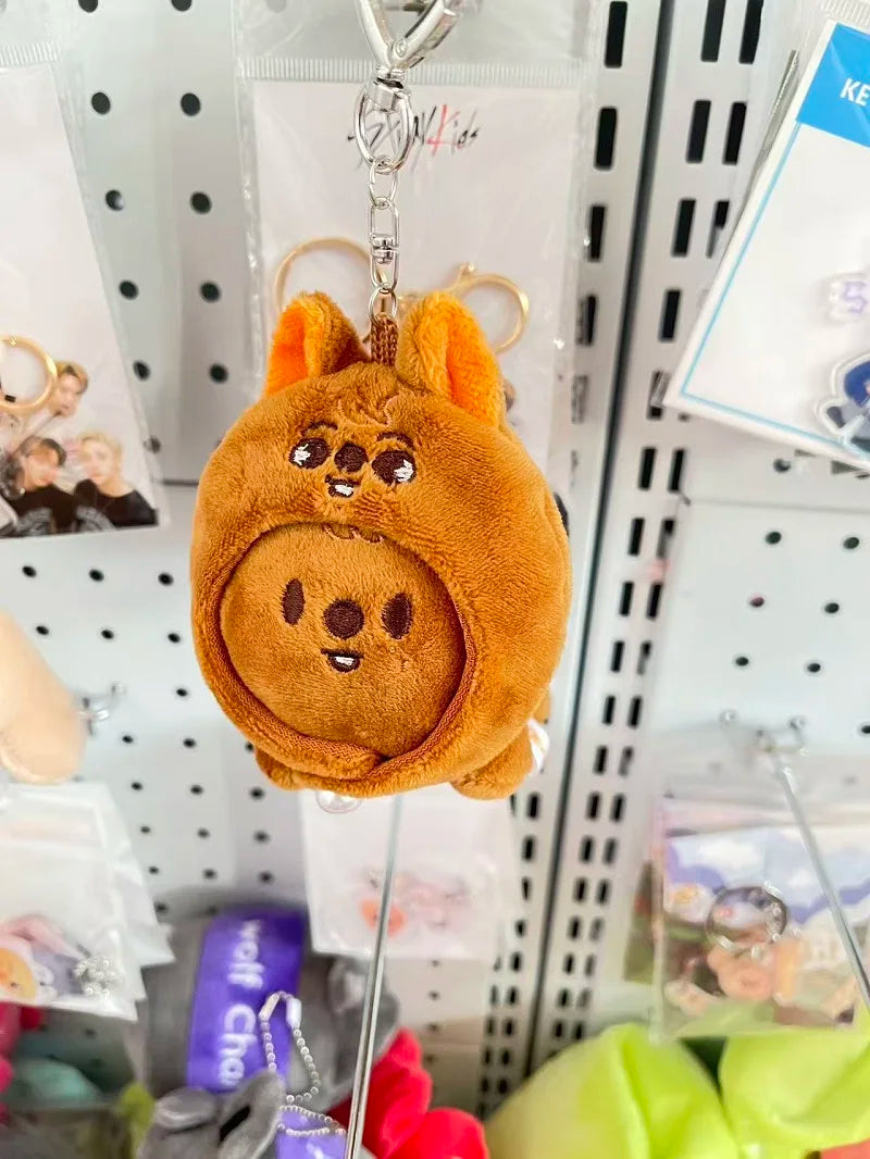 Orange skzoo plush keychain featuring a round smiling character with soft fabric and magic academy cloak design toy fan gift