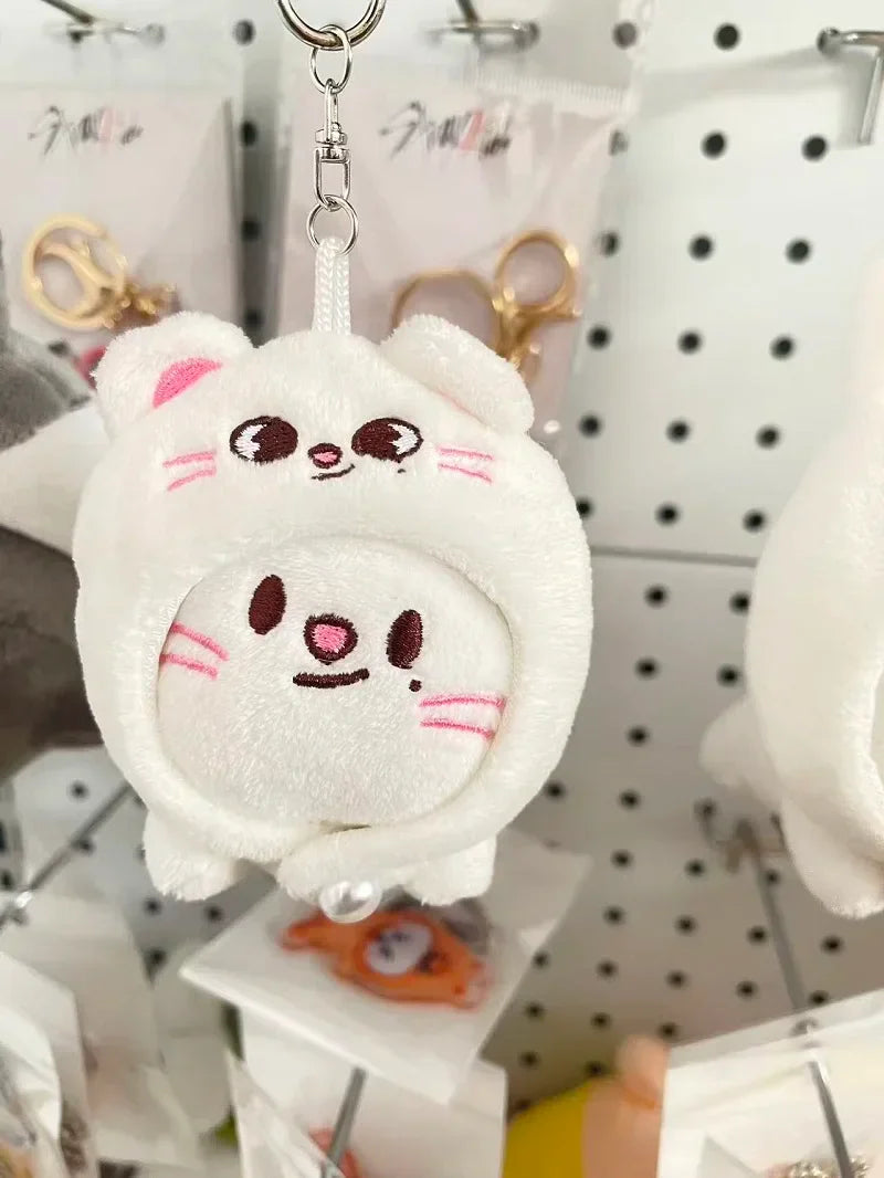 White plush skzoo plush keychain with two embroidered cat faces and silver ring magic academy cloak toy fan gift
