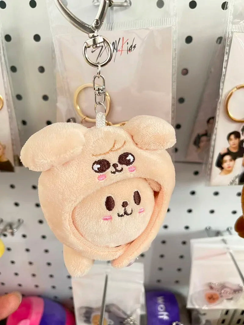 A soft peach-colored skzoo plush keychain featuring a round embroidered character with magic academy cloak design toy fan gift