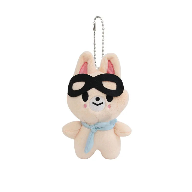 A soft beige skzoo plush keychain rabbit with black sunglasses and light blue scarf as a magic academy cloak toy fan gift