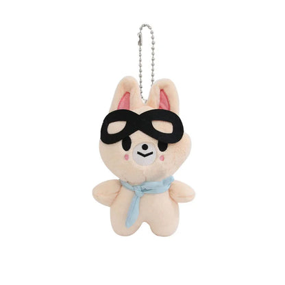 A soft beige skzoo plush keychain rabbit with black sunglasses and light blue scarf as a magic academy cloak toy fan gift