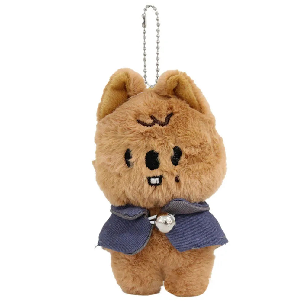 Tan skzoo plush keychain featuring a cartoon cat with embroidered face and magic academy cloak for toy fan gift
