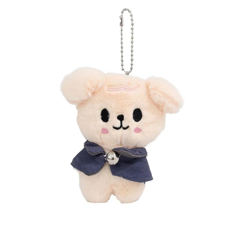 Cream-colored skzoo plush keychain featuring a puppy with a navy bow tie and silver bell magic academy cloak toy fan gift