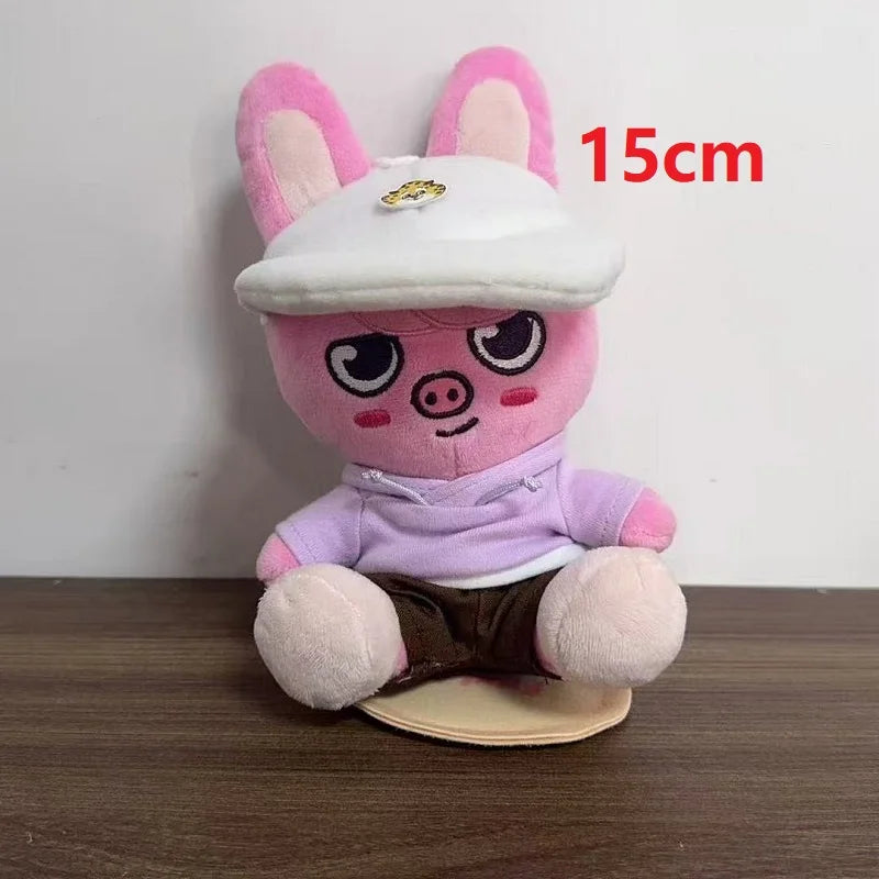 Pink plush pig skzoo plush keychain wearing white cap lavender hoodie and brown shorts magic academy cloak toy fan gift