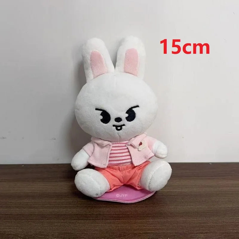 A 15cm white plush skzoo plush keychain rabbit with pink ears wearing a magic academy cloak toy fan gift accessory