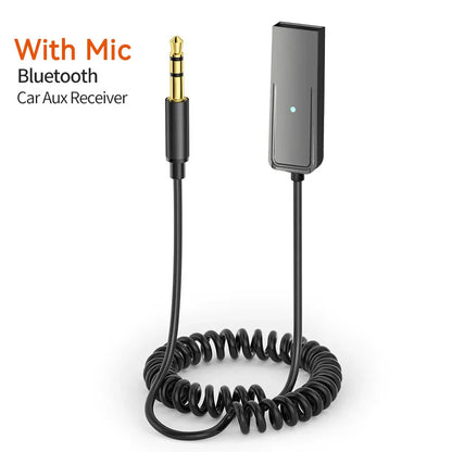 Black coiled cable with gold 3.5mm audio jack and rectangular bluetooth car aux receiver dongle handsfree with led light