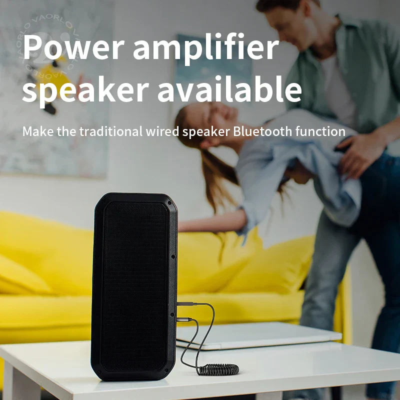 Black rectangular portable bluetooth audio receiver dongle with textured grille and coiled cable for car bt transmit use