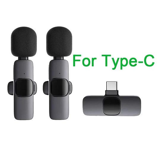 Two sleek matte black wireless lavalier microphones with foam windshields and type-c adapter for camera live gaming