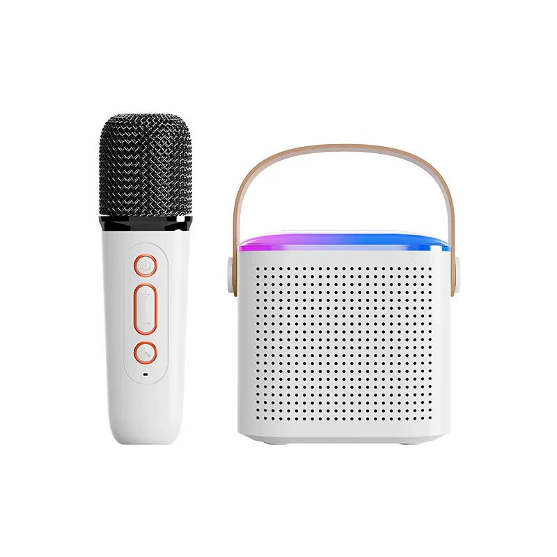 White wireless microphone karaoke with black mesh and orange buttons next to white karaoke machine portable with wooden handle and led lights