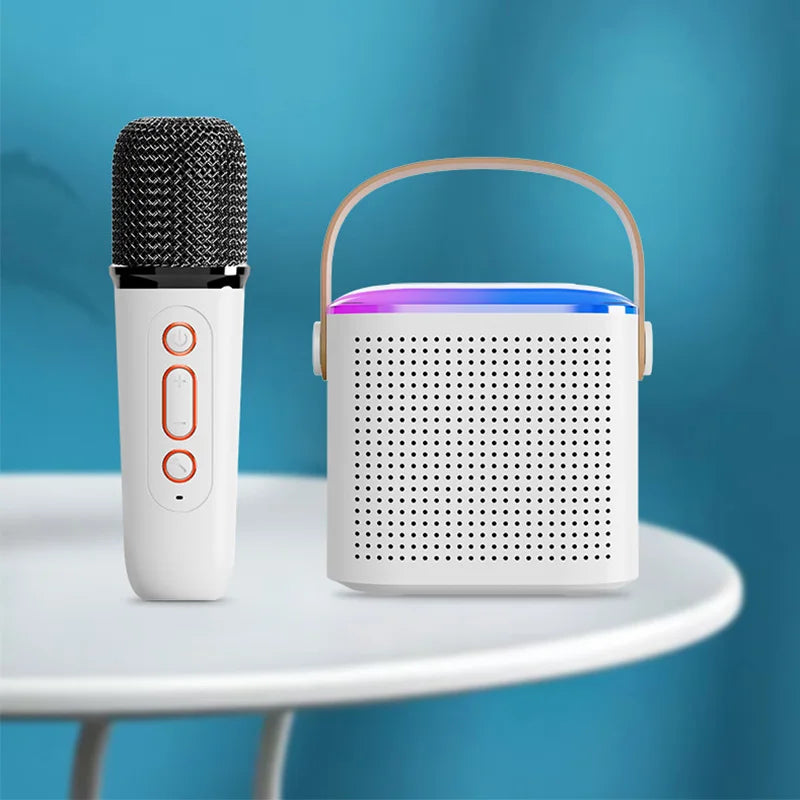 White wireless microphone karaoke with black mesh grille and orange buttons paired with white karaoke machine portable mp3 player karaoke speaker system