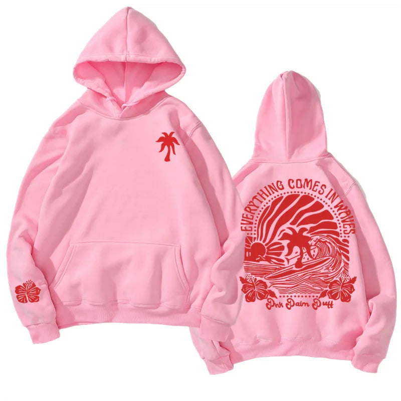 Pink hoodie with red palm tree and wave graphic featuring pink flower print for youth tropical flower island hoodie style