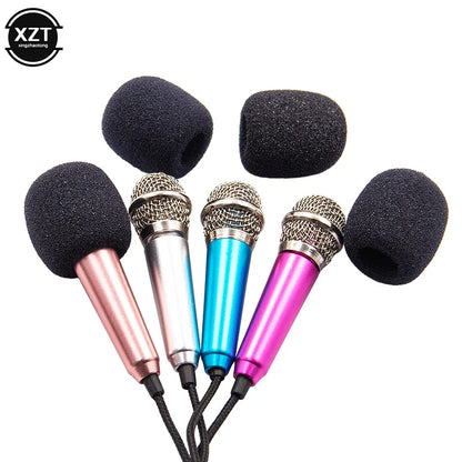 Set of four colorful studio lavalier professional handheld microphones with black foam covers and 3.5mm mini jack connectors