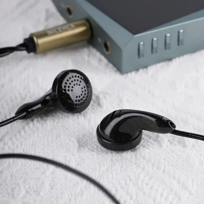 Black nicehck b80 wired flat earbud with glossy finish and perforated housing featuring topologybio diaphragm dynamic