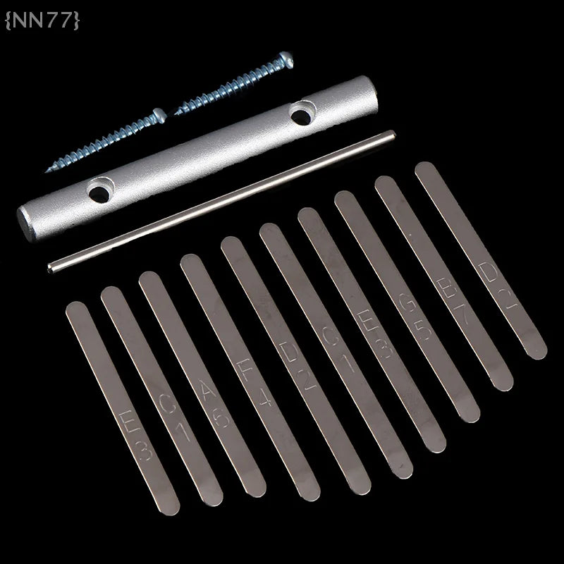 Set of ten silver metal keys replacement kalimba with engraved letters and a cylindrical thumb piano bridge with screws