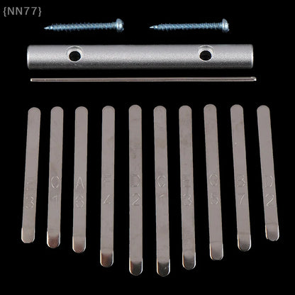 Set of ten silver-toned metal thumb piano bridge components with engraved markings and screws for keys replacement kalimba