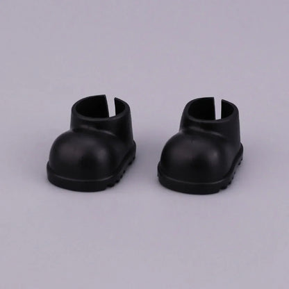 A pair of black plastic doll boots with rounded toe and open back for labubu clothes gifts black suit fashion