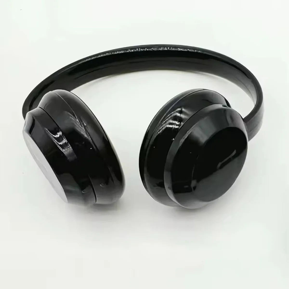Black over-ear headphones with glossy finish and rounded earcups complement cute plush doll black suit fashion labubu clothes gifts