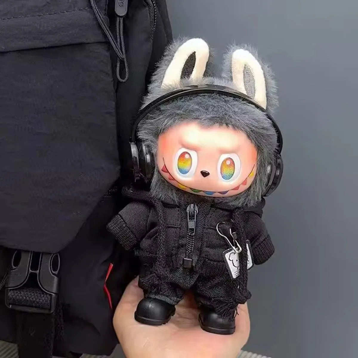 A cute plush doll with gray fur rainbow eyes wearing black suit fashion hoodie jacket for Labubu clothes gifts