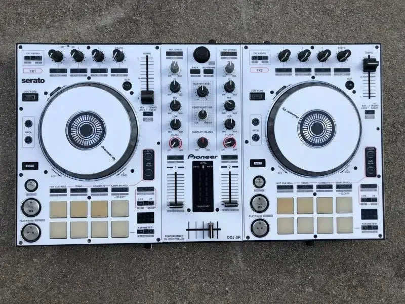 White pioneer ddj-sr dj controller with black knobs fully surrounded by protective stickers from beat music store