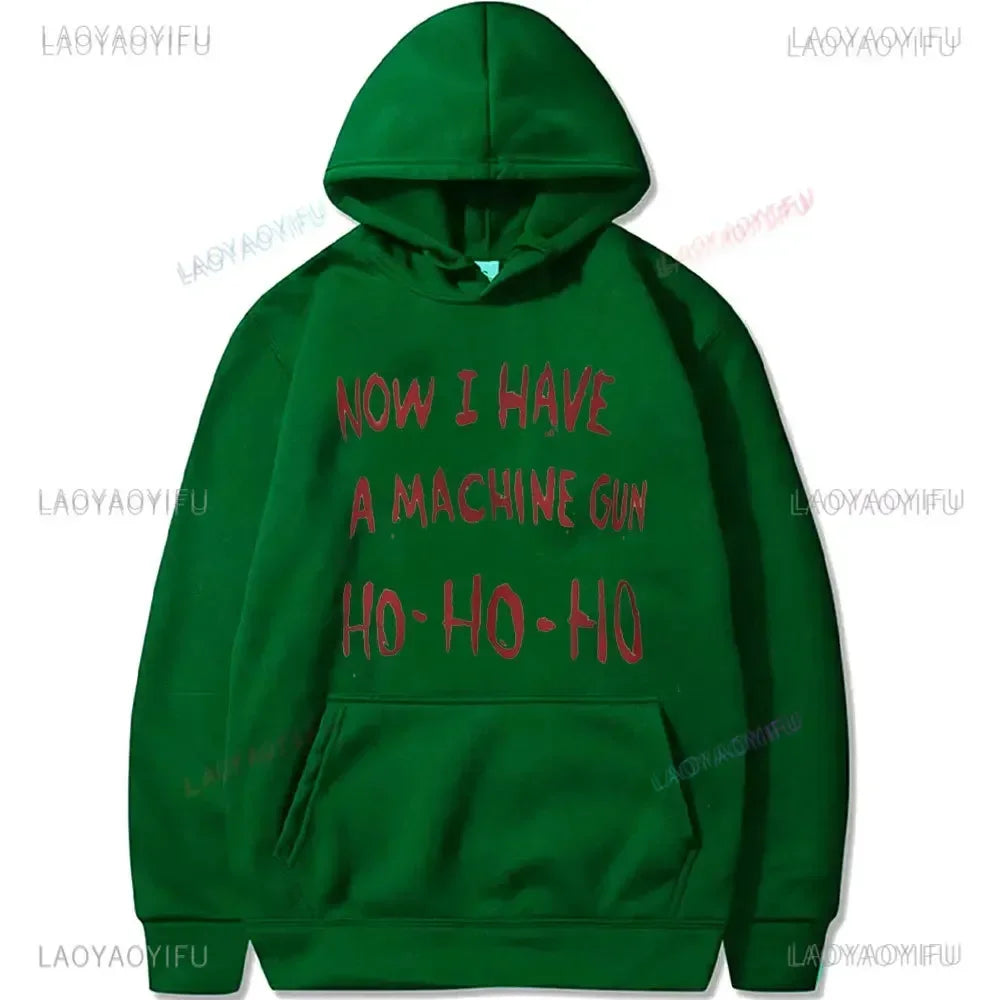 Green hoodie pullover with red text now i have a machine gun ho-ho-ho referencing die hard mclane naktomi plaza