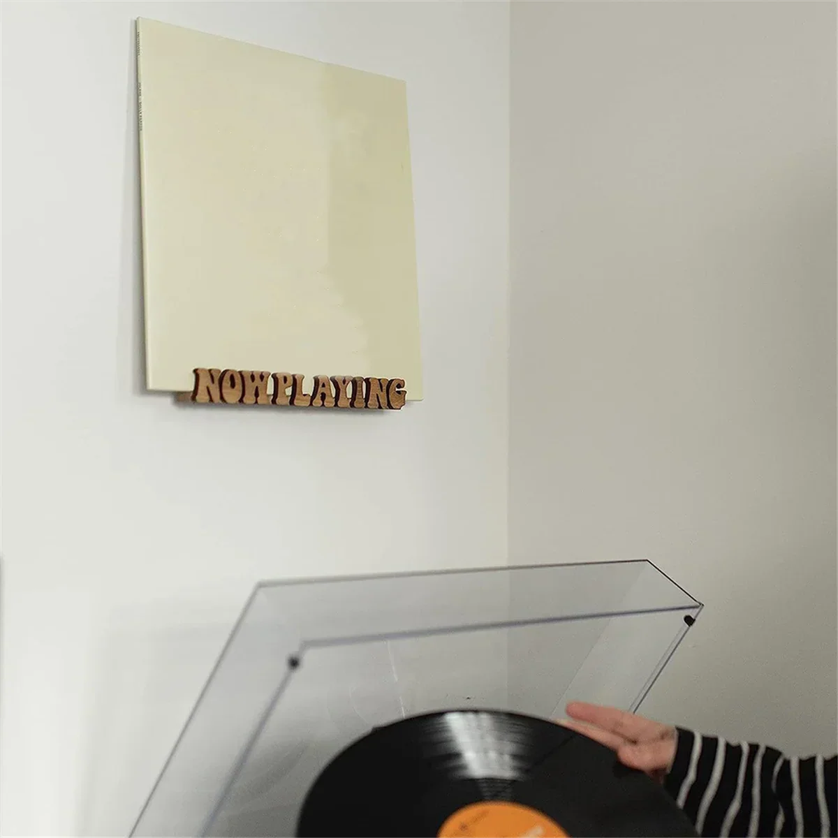 Beige playing vinyl record mounted on wall with solid wood now playing record stand display shelf bracket