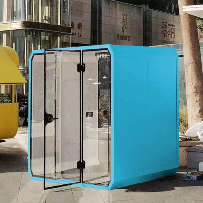 A bright blue cube-shaped office pod soundproof with transparent glass doors and black frames for outdoor meetings