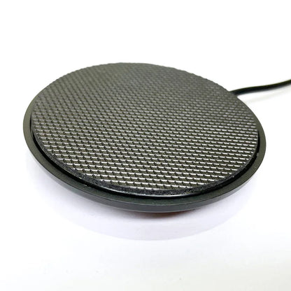 Black circular wireless charging pad with textured grid surface designed for usb voice microphone laptop youtube recording conference streaming meeting