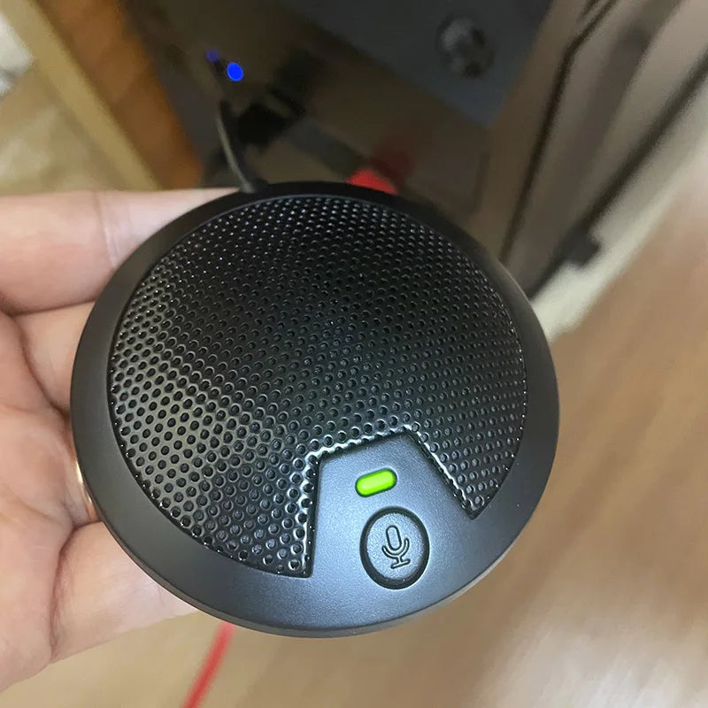 Black omnidirectional desktop usb voice microphone with perforated grille and mute button for laptop youtube recording and meetings