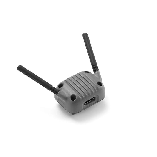 Gray plastic dji neo 2 drone transmitter with two black antennas and usb port for digital image transmission accessories