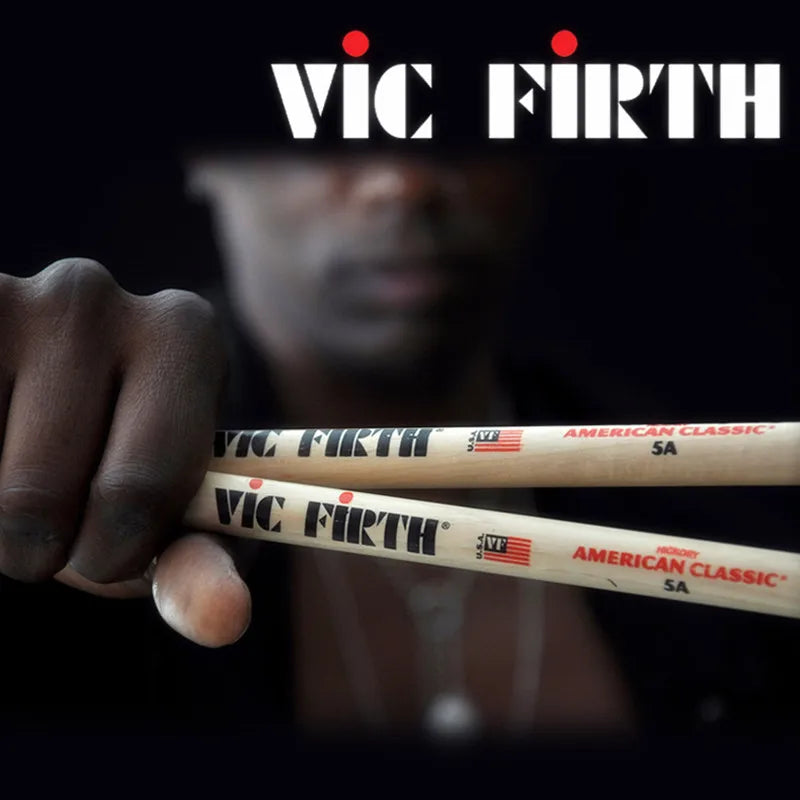 A pair of vic firth American Classic sticks 5a hickory with natural wood finish and black and red branding professional drum sticks