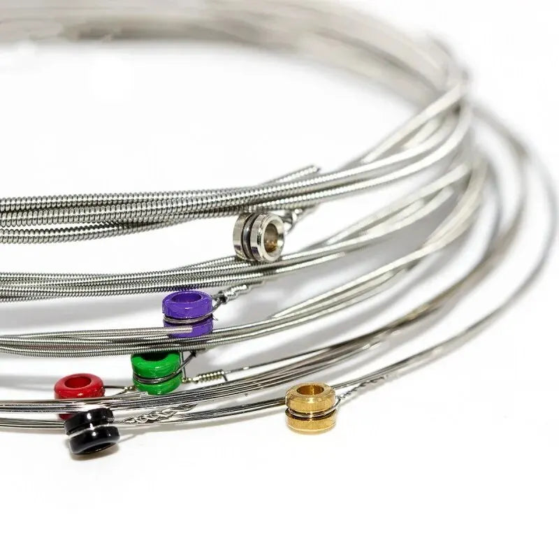 Coiled set of orphee rx15 17 19 guitar strings nickel alloy super light tension with colorful plastic end caps