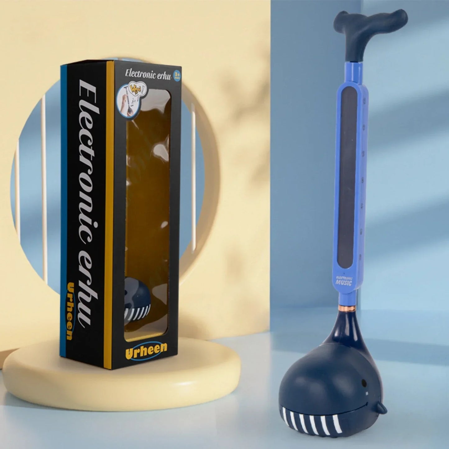 Blue and black whale-shaped otamatone electronic musical toy portable synthesizer tadpole piano educational gift