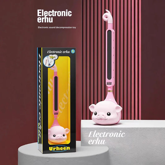 Pink pig-shaped otamatone japanese electronic synthesizer tadpole kawaii toy with glossy finish and usb charging panel