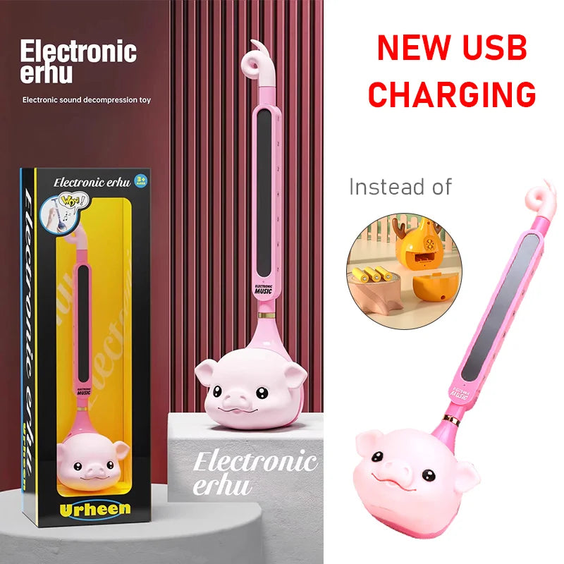 Pink pig-shaped otamatone japanese electronic synthesizer tadpole kawaii with usb charging and glossy finish educational gift