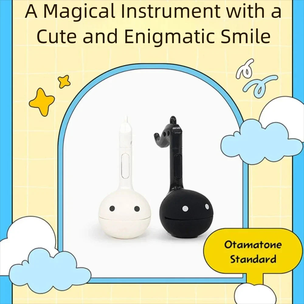 White and black otamatone mini cute electronic music toy with round smiling faces relaxing musical instrument