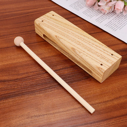 Outdoor percussion instrument wooden clapper made of light-colored madera dura with matching mallet for rhythm play