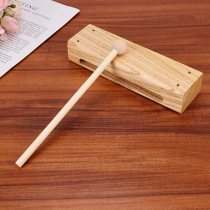 Light-colored wooden madera dura xylophone with matching mallet for outdoor percussion rhythm you can obtener diferentes sounds