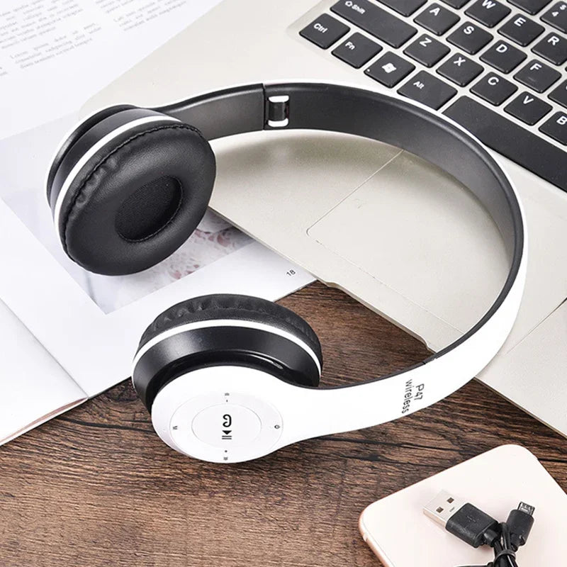 White and black p47 wireless headphones with padded earcups featuring foldable hifi stereo bass for gaming kid girl use