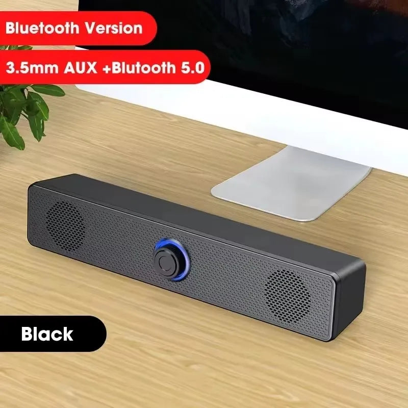 Black rectangular usb powered soundbar with textured surface and illuminated control button for gaming home theater bluetooth speaker usb