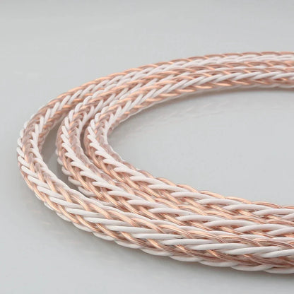 A coiled meter hifi 8tc 7n occ pure copper wire loudspeaker cable with braided rose gold and white strands