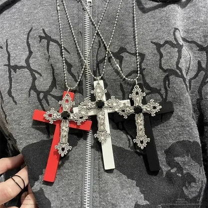 Three ornate cross necklaces with silver metal and black drill cool gemstone centers on red white and black resin bases for women vintage spicy gifts
