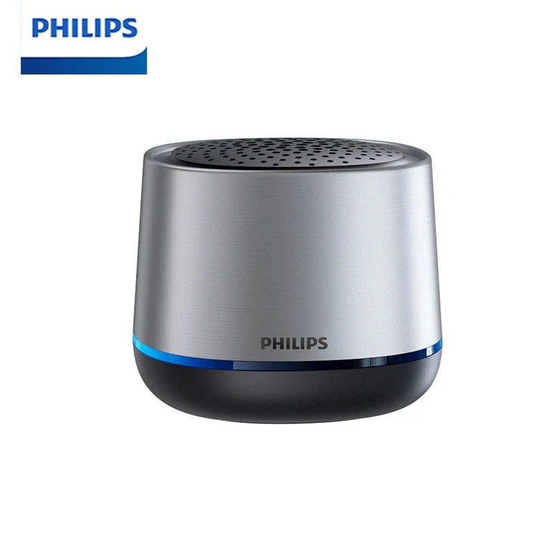 Silver and black philips tas1009 portable wireless speaker with perforated top grille and blue illuminated accent ring