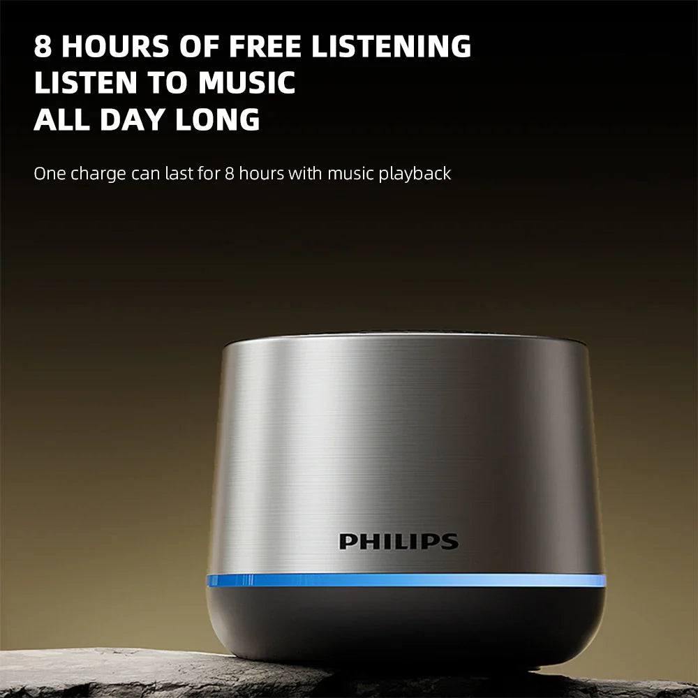 Silver brushed metal philips tas1009 portable wireless speaker with sleek cylindrical design and glowing blue led strip