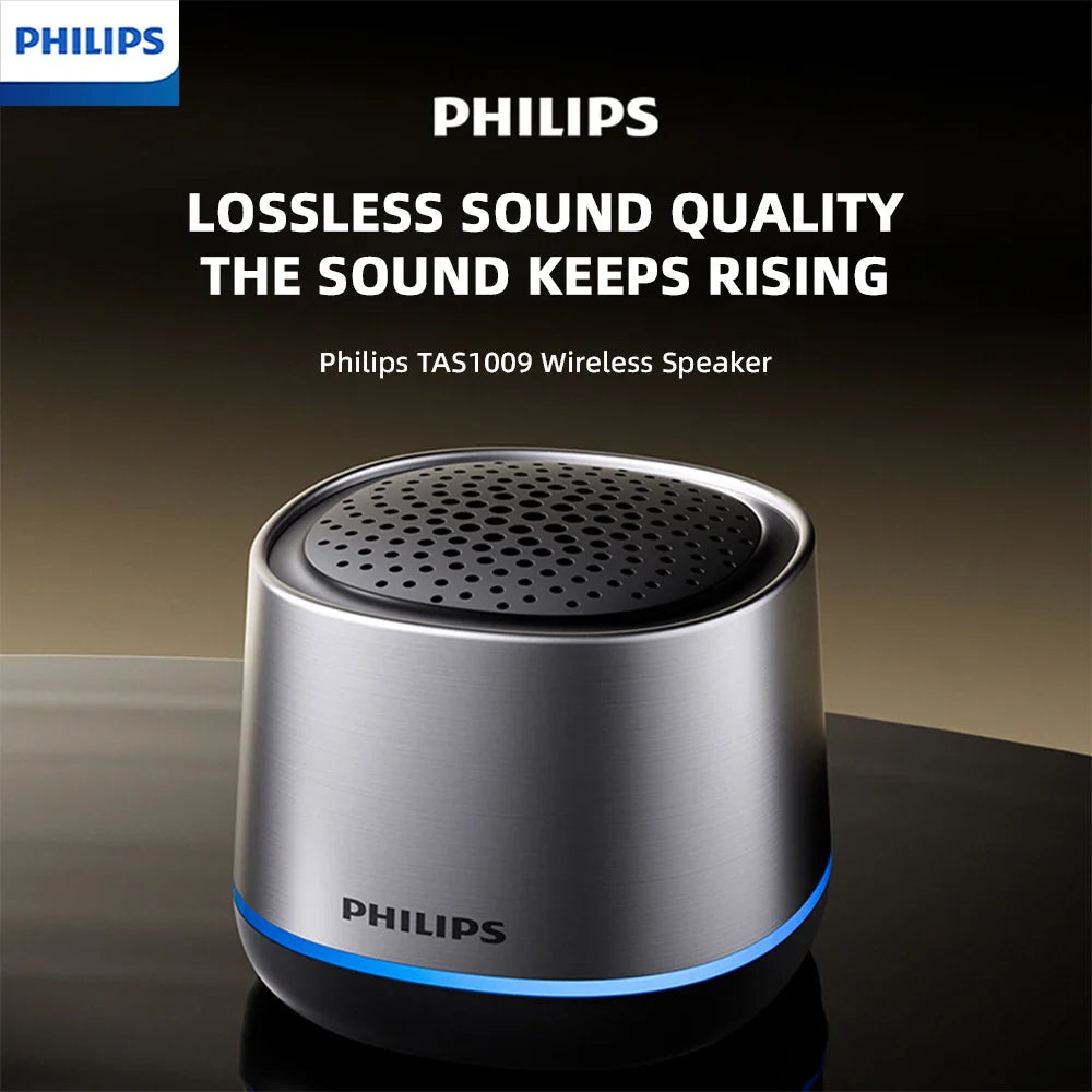 Silver metallic philips tas1009 portable wireless speaker with black perforated top and blue led ring for outdoor use