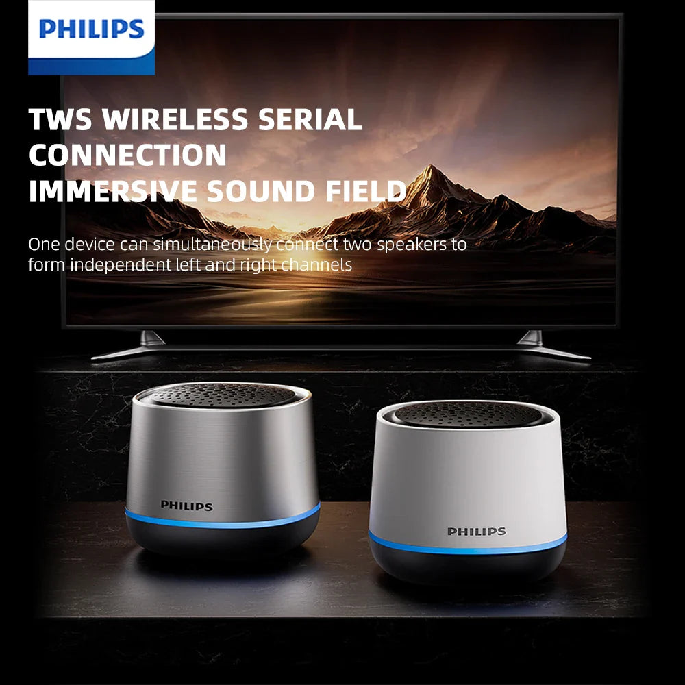 Two philips tas1009 tws wireless portable desktop speakers in silver and white with blue accent ring and rgb subwoofer